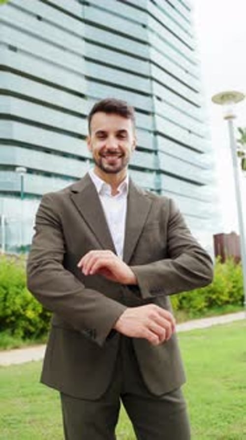 Businessman Showcasing Confidence and Professionalism While Posing Outdoors