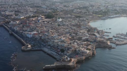 Acre old city port houses and Mosque at sunrise, Aerial view