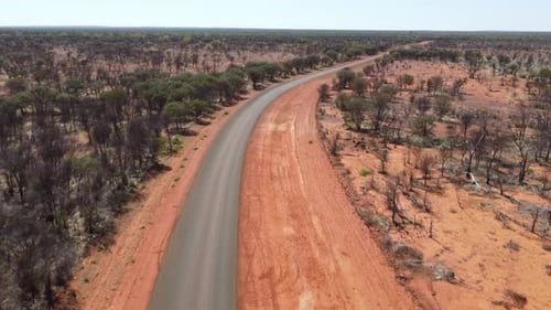 Drone flying over a sealed country road in the Australian Outback