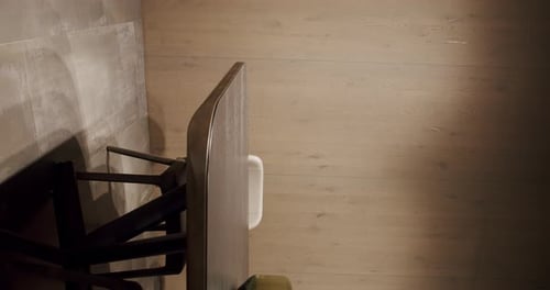 Dining Room With Wooden Table and Glass Vases
