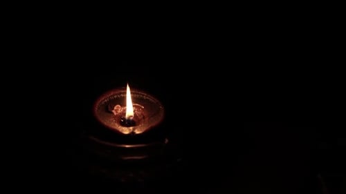 Diya Lamp Flame Burning in the Dark
