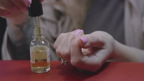 Putting an oil on hands