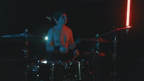 Rock Band Drummer Playing Drums During Live Music Concert