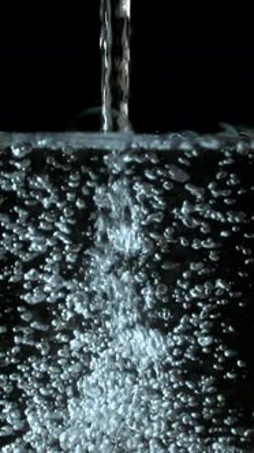 Water Bubbles Fill Screen on Black Background