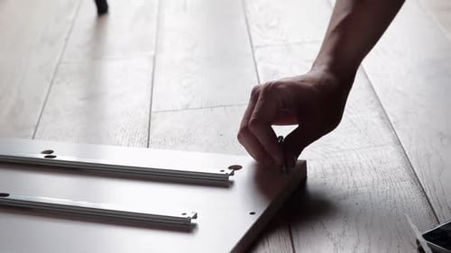 DIY Fail, Man Takes Out Crooked Screw From Wooden Shelf Part