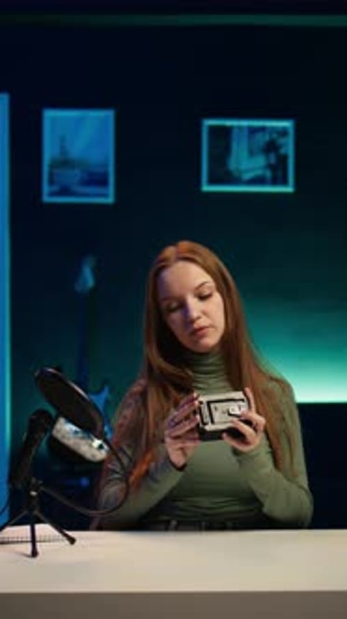 Vertical Video Tech Expert Presenting V Mount Battery Showing It to Subscribers