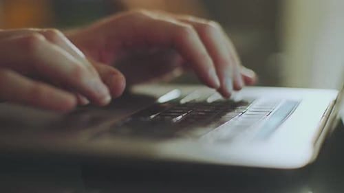 Businessman typing on laptop