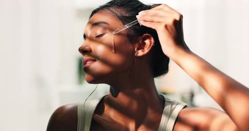 Face serum, pipette and woman in home for skincare, beauty and hydration for glow routine