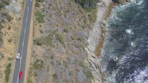 Aerial following car along costal highway in South Africa