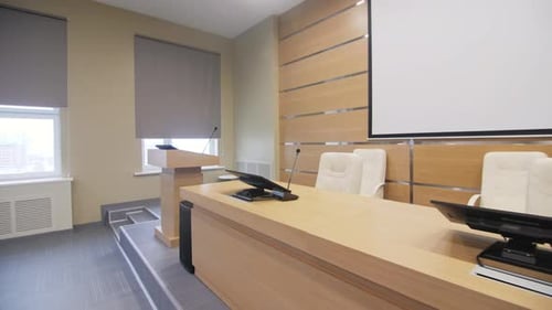 Computers and Mics on Speakers Table in Conference Hall