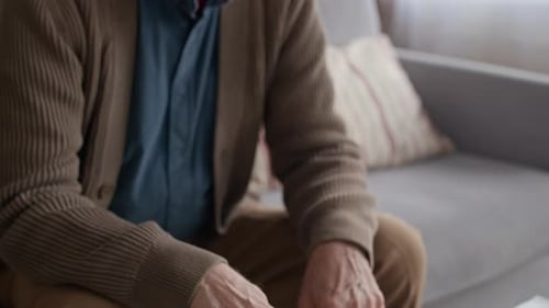 Worried Man Calculating Household Expenses While Reviewing Overdue Bills