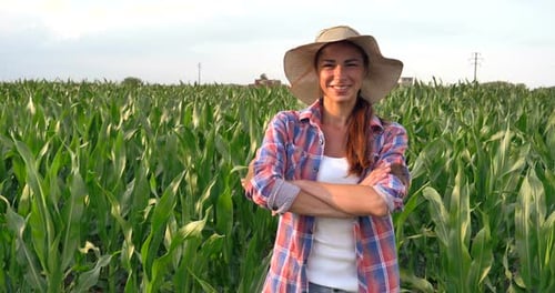 Smiling Woman Farmer in Cornfield