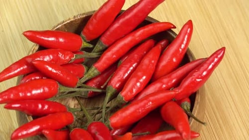 Red Chili Peppers in a Wooden Bowl