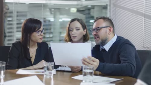 Colleagues Meeting to Discuss Company Strategy and Data