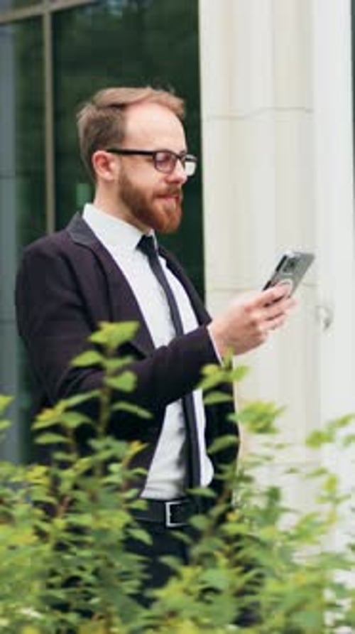 Startup Businessman in Glasses Using Mobile Phone Young Man Texting Messages Cheating on His