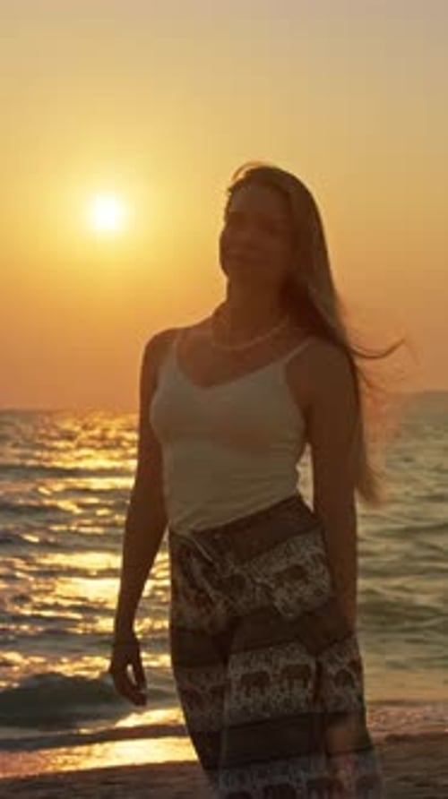 Young Woman Enjoying Sunset at Beach