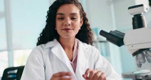Scientist Using Microscope in Modern Laboratory