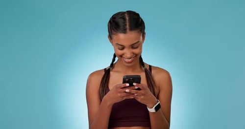 Phone, smile and woman in a studio networking on social media, mobile app or the internet