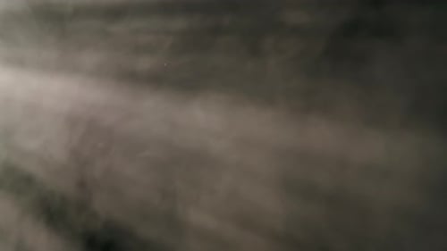 Ethereal Smoke Swirling in Light Rays