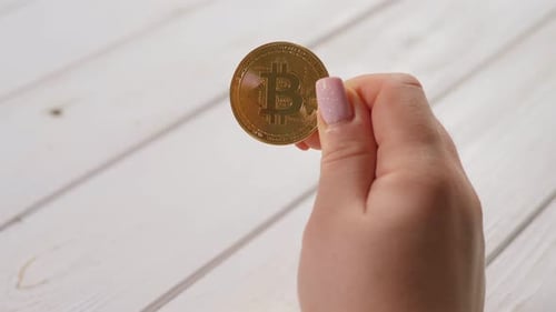 Hand Holding Bitcoin Close Up Golden Coin