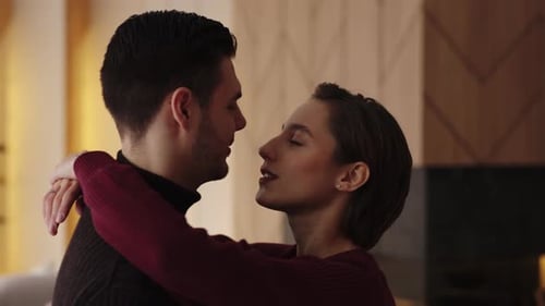 Affectionate Couple Embrace in Cozy Home