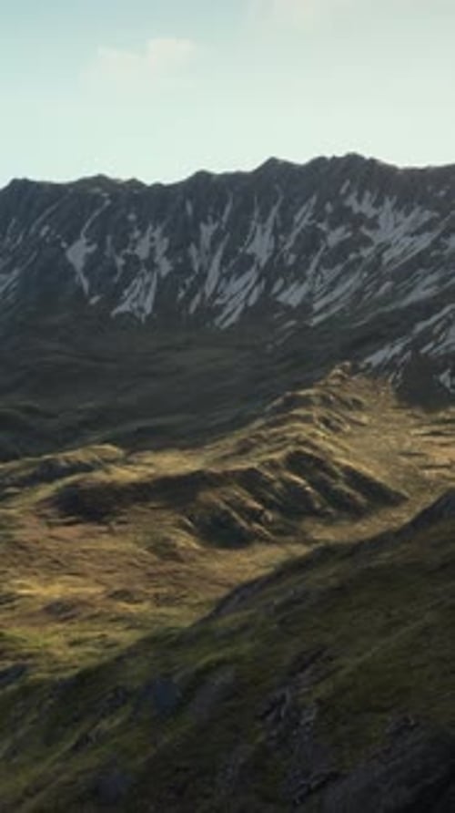 A View of a Mountain Range From the Top of a Hill