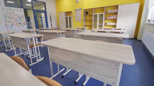 Bright Empty Classroom with Desks and Chairs