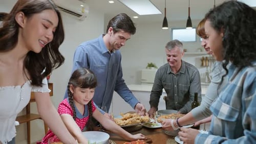 Family Celebrates a Holiday at Home with Food