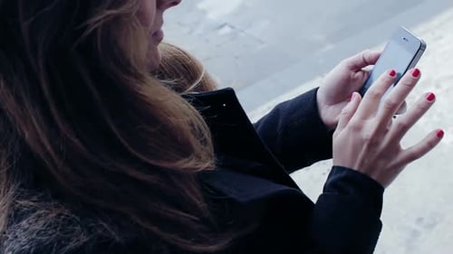 Woman Using Smartphone in the City