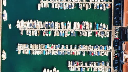 Aerial Top Down View of Docked Sailboats Yachts and Boats in Harbor