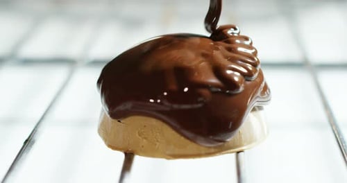 Chocolate Glaze Flowing Over Fresh Pastry