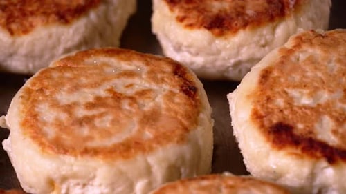 Cottage cheesecakes are fried in pan. Process of cooking delicious homemade food