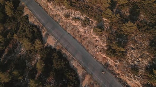 Aerial drone footage of motorbike moving on the mountain