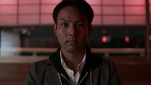 Man Close Up in Dark Restaurant at Night