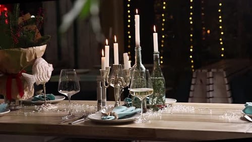 Beautifully Decorated Table Setting with Candles and Christmas Decor