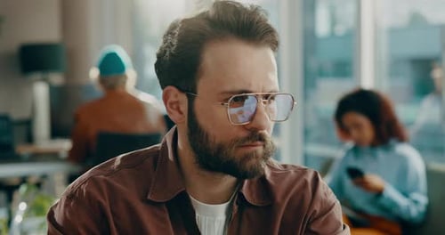 Glasses, man and reading on computer in office for research, review article and editing draft