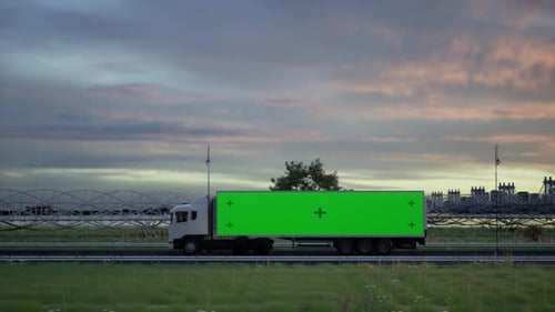 White Semi Truck Driving on Highway at Sunset with Green Screen Mockup