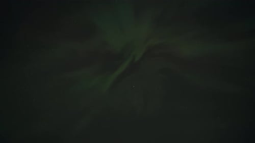 a time lapse looking straight up at the northern lights aurora borealis from the ground on a clear n