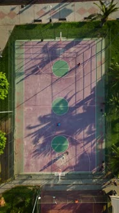 Vertical Video Seaside Hoops Aerial Views of Basketball Court