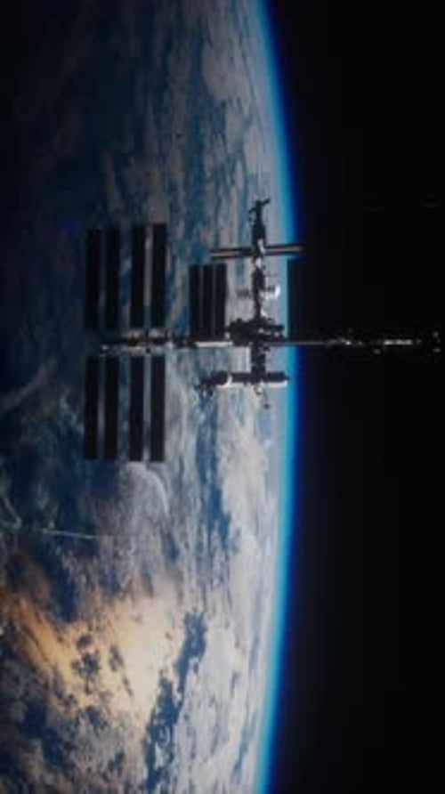 ISS Orbits Earth Amid the Vastness of Space and Atmosphere