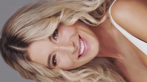 Studio Portrait of Young and Beautiful Blond Woman Over Grey Background Skin Care and Wellness