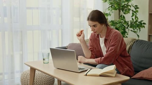 Woman Working From Home on Her Laptop