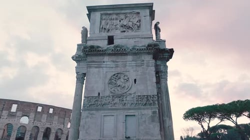 Aerial view around details on the side of the Arch of Constantine, in Rome, Italy - low angle,