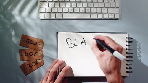 Hands Write Black Friday in Notebook, Overhead