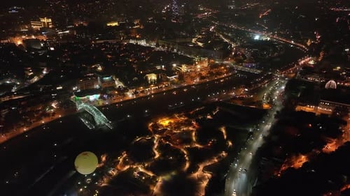 Aerial view of Tbilisi city central park and Bridge of Peace. Beautiful cityscape of old Tbilisi