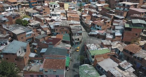 Aerial Drone Flying over ghetto slums of touristic area of Comuna 13, Meddelin, Colombia