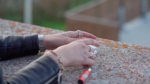 Girl taking a cigarettes from pack in slow motion