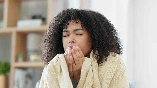Young Adult Woman Coughing into Hands, Feeling Sick