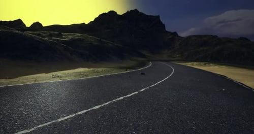 Curving Road Through a Dramatic Landscape Under a Colorful Sky at Dusk