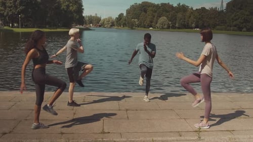 Diverse Group of People Marching in Place during Outdoor Workout